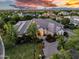 Stunning estate featuring mature trees, a circular driveway, and meticulous landscaping at 20644 E Sunrise Ct, Queen Creek, AZ 85142