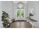 Bright and airy foyer showcasing hardwood floors, a grand chandelier, and a view of the outdoors at 20644 E Sunrise Ct, Queen Creek, AZ 85142