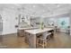 Gourmet kitchen boasting a double island, dining area, and modern design elements for an open, airy feel at 20644 E Sunrise Ct, Queen Creek, AZ 85142