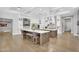Expansive kitchen featuring double islands, custom cabinetry, and seating for casual dining at 20644 E Sunrise Ct, Queen Creek, AZ 85142