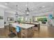Spacious kitchen featuring dual islands, designer lighting, and an open floor plan for easy entertaining at 20644 E Sunrise Ct, Queen Creek, AZ 85142