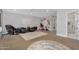 Expansive living area with hardwood floors and a full suite of recreational equipment at 20644 E Sunrise Ct, Queen Creek, AZ 85142