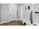 Functional mudroom featuring built-in storage shelves and coat hooks at 20644 E Sunrise Ct, Queen Creek, AZ 85142