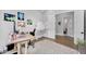 Spacious home office featuring an open workspace and lots of natural light at 20644 E Sunrise Ct, Queen Creek, AZ 85142