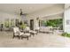 Comfortable outdoor living space under covered patio with tile flooring and ample seating at 20644 E Sunrise Ct, Queen Creek, AZ 85142