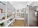 Walk-in pantry featuring abundant shelving, organized storage, and convenient access from the main kitchen area at 20644 E Sunrise Ct, Queen Creek, AZ 85142