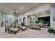 Spacious covered patio featuring comfortable seating, a ceiling fan, and a serene outdoor dining area at 20644 E Sunrise Ct, Queen Creek, AZ 85142