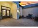 Inviting outdoor patio with stylish seating area and brick pavers, perfect for relaxing and entertaining guests at 20644 E Sunrise Ct, Queen Creek, AZ 85142