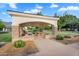 Covered picnic area with stone columns, built-in grill, and seating, surrounded by green space at 20644 E Sunrise Ct, Queen Creek, AZ 85142