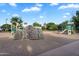 A view of the rock-climbing wall and other elements of the community playground at 20644 E Sunrise Ct, Queen Creek, AZ 85142