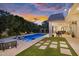 Backyard oasis with pool, landscaped surroundings, lounge chairs, and covered patio, designed for luxurious outdoor living at 20644 E Sunrise Ct, Queen Creek, AZ 85142
