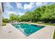 Inviting backyard pool surrounded by lush greenery and a well-maintained patio area at 20644 E Sunrise Ct, Queen Creek, AZ 85142