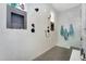 Modern walk-in shower featuring dual shower heads and gray tile accents at 20644 E Sunrise Ct, Queen Creek, AZ 85142