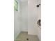 Modern shower with white subway tile, window, and grey hexagonal tile flooring at 20644 E Sunrise Ct, Queen Creek, AZ 85142