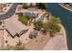 Aerial shot of a house close to a lake, with a pool and solar panels at 20986 N 66Th Ln, Glendale, AZ 85308