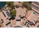 Overhead view of a property featuring a backyard pool, desert landscaping, and a neighborhood pond nearby at 20986 N 66Th Ln, Glendale, AZ 85308
