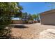 Serene backyard showcasing lush greenery, mature trees, offering a private and tranquil outdoor space at 20986 N 66Th Ln, Glendale, AZ 85308