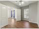 Spacious bedroom features a ceiling fan, wood floors and natural light from the window at 20986 N 66Th Ln, Glendale, AZ 85308