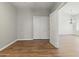 Bedroom with wood floors, closet, and natural light creates a welcoming space at 20986 N 66Th Ln, Glendale, AZ 85308