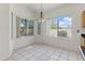 Bright breakfast nook with views of the desert landscaping provides a tranquil start to the day at 20986 N 66Th Ln, Glendale, AZ 85308