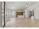 Spacious living room with tile flooring offers a versatile layout, with kitchen view and patio access at 20986 N 66Th Ln, Glendale, AZ 85308