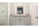Bathroom featuring a vanity with ample storage, decorative mirror, and modern finishes at 2211 N Recker Rd, Mesa, AZ 85215