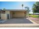Spacious carport offering covered parking and easy access to nearby green space at 2211 N Recker Rd, Mesa, AZ 85215