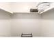 Walk-in closet space with shelving, shoe rack, and storage for an organized wardrobe at 2211 N Recker Rd, Mesa, AZ 85215