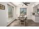 Bright dining area with a ceiling fan, backyard views, and great natural light at 2211 N Recker Rd, Mesa, AZ 85215