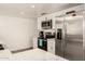 Bright, modern kitchen features white cabinets and stainless steel appliances at 2211 N Recker Rd, Mesa, AZ 85215
