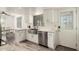 Bright kitchen features stainless steel appliances, undermount sink, white cabinets, and modern finishes at 2211 N Recker Rd, Mesa, AZ 85215