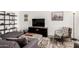 Cozy living room with a modern aesthetic, stylish furniture, and natural light at 2211 N Recker Rd, Mesa, AZ 85215