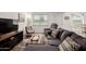 Comfortable living room features modern furniture, stylish decor, and lots of natural light at 2211 N Recker Rd, Mesa, AZ 85215