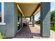 Inviting covered patio area with a paved walkway leading to the lush backyard at 23179 S 225Th Pl, Queen Creek, AZ 85142