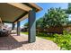 Covered patio overlooking a meticulously landscaped backyard, perfect for entertaining at 23179 S 225Th Pl, Queen Creek, AZ 85142