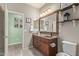 Inviting bathroom featuring warm wood tones and a vanity at 23179 S 225Th Pl, Queen Creek, AZ 85142