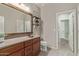 Inviting bathroom featuring warm wood tones and a large vanity at 23179 S 225Th Pl, Queen Creek, AZ 85142