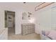 Charming Bedroom room with light pink walls, wood dresser and decor at 23179 S 225Th Pl, Queen Creek, AZ 85142