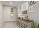 Bright entryway featuring stylish decor, a decorative console table, and a view into the home at 23179 S 225Th Pl, Queen Creek, AZ 85142