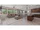 Open-concept living room and kitchen, with a large sectional sofa, and lots of natural light at 23179 S 225Th Pl, Queen Creek, AZ 85142