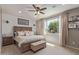 Cozy main bedroom with a comfortable bed, stylish decor, and ample natural light at 23179 S 225Th Pl, Queen Creek, AZ 85142