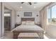 Comfortable main bedroom featuring elegant decor, ample natural light, and a cozy ambiance at 23179 S 225Th Pl, Queen Creek, AZ 85142