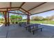 Covered picnic area with tables and benches in a community park setting at 23179 S 225Th Pl, Queen Creek, AZ 85142