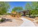 Community playground with play structure and covered seating, with wood chip and rock surfacing at 23179 S 225Th Pl, Queen Creek, AZ 85142