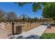 This is a swing set in a playground covered in mulch with a bench off to the side at 23179 S 225Th Pl, Queen Creek, AZ 85142