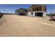 A new construction home with visible wood framing and open space behind it at 2351 E Homesteader Rd, San Tan Valley, AZ 85140
