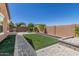 Backyard features artificial turf area and low maintenance landscaping at 2368 E Bellerive Dr, Gilbert, AZ 85298