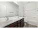 Bathroom features double sinks, and a shower over tub with tile surround at 2368 E Bellerive Dr, Gilbert, AZ 85298
