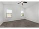 Clean bedroom with wood-style flooring, light walls, and a ceiling fan at 2368 E Bellerive Dr, Gilbert, AZ 85298