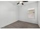 Spare bedroom featuring wood-style flooring and a neutral color scheme at 2368 E Bellerive Dr, Gilbert, AZ 85298